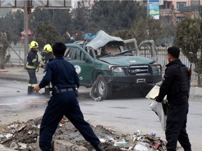 Police arrive at the site of a bomb blast which killed at least two people and injured five others in Kabul on Feb. 21, 2021. Violence has been escalating in Afghanistan, particularly against journalists and human rights defenders, as the U.S. reviews the agreement that the Trump administration negotiated with the Taliban and Afghan government.