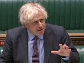 British Prime Minister Boris Johnson answers a question  on COVID-19 in the House of Commons in London on Feb. 22, 2021.