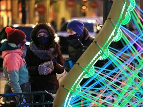 Calgarians braved the cold to check out the lights of Chinook Blast along Stephen Avenue Mall in Calgary on Saturday, February 13, 2021.
