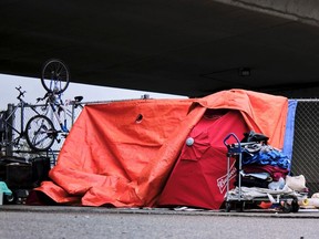 CP-Web.  A homeless camp under an overpass in Calgary on May 20, 2020, amid a worldwide COVID-19 pandemic. The Alberta government has announced $48 million in funding for shelters and community organizations that have been serving homeless people during the COVID-19 pandemic. The money is on top of $25 million announced in March.