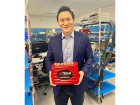 Walter Chang, CEO of wireless communication company 3D-P, with the Intelligent Endpoint system that is designed and manufactured in Calgary.