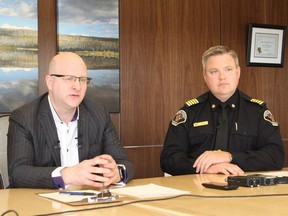 Mayor Don Scott sits with Regional Fire Chief Jody Butz during a press conference in Fort McMurray on May 3, 2018.
