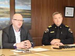 Mayor Don Scott sits with Regional Fire Chief Jody But during a press conference at the Jubilee Centre in Fort McMurray, Alta. On May 3, 2018.