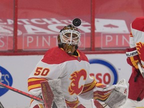 Feb 25, 2021; Ottawa, Ontario, CAN; Calgary Flames goalie Artyom Zagidulin (50) follows the puck against the Ottawa Senators in the second period at the Canadian Tire Centre. Mandatory Credit: Marc DesRosiers-USA TODAY Sports ORG XMIT: IMAGN-445227