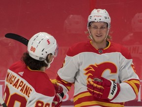 Feb 27, 2021; Ottawa, Ontario, CAN; Calgary Flames defenseman Juuso Valimaki (6) celebrates with left wing Andrew Mangiapane (88) after scoring a goal against the Ottawa Senators in the first period at the Canadian Tire Centre. Mandatory Credit: Marc DesRosiers-USA TODAY Sports ORG XMIT: IMAGN-445244