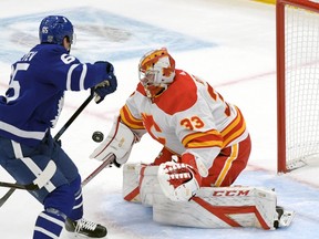 Calgary Flames netminder David Rittich makes the save on Maple Leafs forward Ilya Mikheyev in the second period at Scotiabank Arena on Monday night in Toronto.