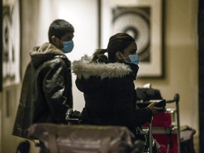 International travellers arrive for quarantine at the Sheraton Gateway Hotel attached to Terminal 3 at Toronto Pearson International airport on Monday February 22, 2021.