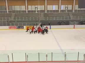 Calgary Hitmen players, including Sean Tschigerl and Riley Stotts, practice from their new temporary home at Seven Chiefs Sportsplex. Photos courtesy of Calgary Hitmen