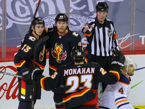 Calgary Flames Sam Bennett celebrates with teammates after scoring a goal against the Edmonton Oilers during NHL hockey in Calgary on Saturday February 6, 2021. Al Charest / Postmedia