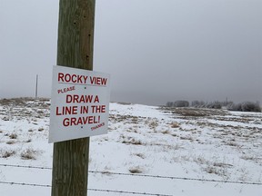Sign encouraging opposition to a gravel mine is seen at its proposed site at Rocky Ridge Rd. and 144 Ave. N.W. on Feb. 2, 2021.