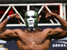 In this Dec. 13, 2019, file photo, Kamaru Usman poses during the ceremonial weigh-in event ahead of his fight against Colby Covington in UFC 245 at T-Mobile Arena in Las Vegas.