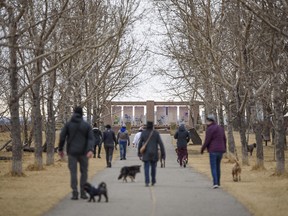 People spend the overcast afternoon in Tom Campbell’s Hill Natural Park on Wednesday, March 24, 2021.