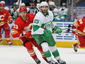 TORONTO, ON - MARCH 19:  Sam Bennett 393 of the Calgary Flames skates against Alexander Kerfoot #15 of the Toronto Maple Leafs during an NHL game at Scotiabank Arena on March 19, 2021 in Toronto, Ontario, Canada.