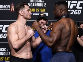 LAS VEGAS, NEVADA - MARCH 26: In this handout photo provided by UFC,  (L-R) Opponents Stipe Miocic and Francis Ngannou of Cameroon face off during the UFC 260 weigh-in at UFC APEX on March 26, 2021 in Las Vegas, Nevada.