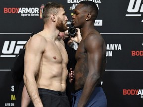LAS VEGAS, NEVADA - MARCH 05: (L-R) Opponents Jan Blachowicz of Poland and Israel Adesanya of Nigeria face off during the UFC 259 weigh-in at UFC APEX on March 05, 2021 in Las Vegas, Nevada.
