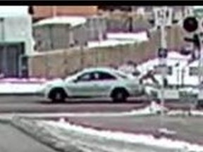 Calgary Police Service released several images of a car sought as part of a hit-and-run investigation. The car, believed to be a light-coloured Honda Accord, was involved in the hit-and-run of a cyclist on Dec. 15, 2020. Calgary Police Service