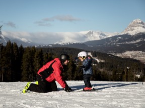 An image of a father and a daughter at Pass Powderkeg Ski Area in Crowsnest Pass, Alberta, Canada.