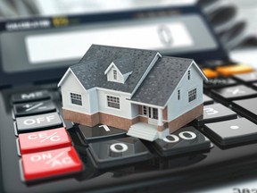 Mortgage calculator. House on buttons. Real estate concept. 3d. Getty Images/iStockphoto