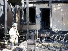 Calgary fire crews investigate an early morning fire on 4 St. and 20th ave. N.W. on Saturday, March 13, 2021.