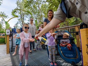 Attendants have their hands sanitized just before entering Brawn Family Foundation Bugtopia on its grand opening on Friday, June 26, 2020. The insects-themed play space is designed to encourage children to learn more about the tiny creatures. Azin Ghaffari/Postmedia