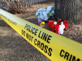 A memorial marks the scene of a suspicious death in the 5200 block of Memorial Drive S.E. on Sunday, March 28, 2021. Shots were fired on Saturday evening March 27 leading to the death. 
Gavin Young/Postmedia