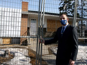 Investigator Rob Pracic is seen outside a home on Centre St. N. that has been closed for 90 days by the Safer Communities and Neighbourhoods (SCAN) unit of the Alberta Sheriffs. Officers on scene describe the house as one of the most drug complaints the unit has had with over 30 neighbours sharing concerns. The drug house is located just metres from a community playground. Thursday, March 4, 2021.