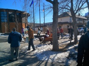 Protesters turned up with signs out front of Canmore’s town hall on Tuesday for the first day of public hearings on proposed developments along the Three Sisters Parkway.