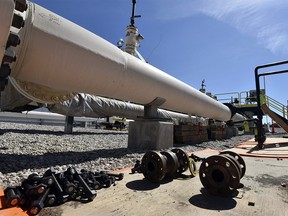 In this June 8, 2017 file photo, fresh nuts, bolts and fittings are ready to be added to the east leg of the pipeline near St. Ignace, Michigan.