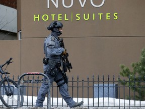 Calgary police investigate an officer-involved shooting at the Nuvo Hotel in Calgary on Wednesday, March 3, 2021.
