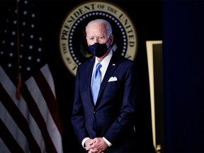 FILE PHOTO: U.S. President Joe Biden attends an event where he announced administration plans to double its order of the single-shot Johnson & Johnson coronavirus vaccine, procuring an additional 100 million doses, in the South Court Auditorium at the White House in Washington, U.S., March 10, 2021.