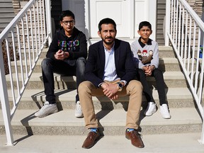 Usman Sadiq and his two sons Asher, a Grade 11 student and Shaaf, a Grade 6 student, moved from their community of Evanston after growing tired of waiting for a new school to be built. Photo taken on Friday, March 19, 2021.