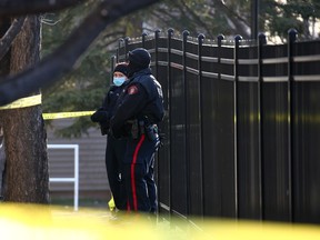 Calgary police hold the scene of an early morning triple stabbing in the 2500 block of 38 Street N.E. in Rundle on Wednesday, March 31, 2021. Three people were taken to hospital from a unit in the condo complex, two in life-threatening condition.