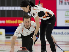 Calgary Ab,March 25, 2021.WinSport Arena at Calgary Olympic Park.Home Hardware Canadian Mixed Double Curling Championship.Kerry Einarson of Gimli MB, and Brad Gushue of St.John's NL, during the final game against team Kadriana Sahaidak and Colton Lott of Winnipeg Beach Mb.Curling Canada/ Michael Burns Photo