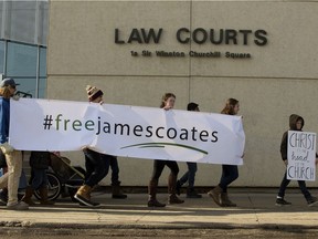 Supporters of jailed Pastor James Coates march outside the Edmonton courthouse where he was scheduled for a hearing regarding his bail release conditions, Thursday March 4, 2021. Coates is in remand after failing to comply with COVID-19 public health regulations at his GraceLife Church near Spruce Grove.