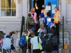 Students at Stanley Jones School head into classes on Tuesday, September 1, 2020. It was the first day for Calgary Board of Education students starting back amidst the COVID-19 pandemic.