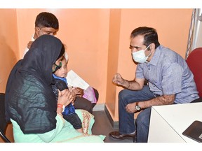 Kashinath Bhoosnurmath, the new president and CEO of Operation Eyesight, speaks with a girl being treated at the Operation Eyesight Institute for Eye Cancer in Hyderabad, India.