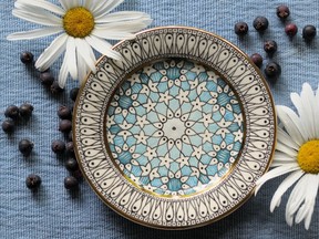Slip-trailed, hand-painted dessert plates by Tanya Everard.