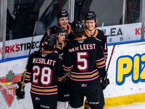 The Calgary Hitmen celebrate during their 7-4 win over the Lethbridge Hurricanes at the Enmax Centre in Lethbridge on Sunday, March 21, 2021.