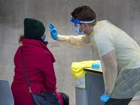 A swab is taken at a COVID-19 testing site on the Dalhousie University campus in Halifax on Nov. 25, 2020.