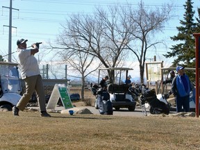 Seun Ogunsola tees off as golfers enjoy the links on a warm first day of spring as HeatherGlen Golf Course opened for the season on Saturday, March 20, 2021.