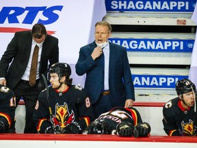 Calgary Flames head coach Geoff Ward reacts from the bench during against the Vancouver Canucks at the Saddledome in Calgary on Feb. 17, 2021.