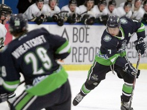 Canucks defenceman Jason Chu skates the puck into the offensive zone in second period action as the Calgary Canucks host the Okotoks Oilers at the Max Bell Arena as the AJHL season kicks off. Friday, November 13, 2020. Brendan Miller/Postmedia