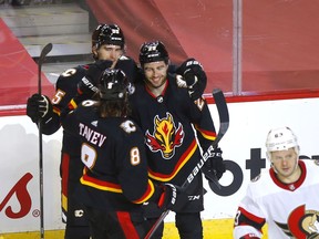 Calgary Flames Dillon Dube celebrates his hat trick against the Ottawa Senators in third period action at the Scotiabank Saddledome in Calgary on Thursday, March 4, 2021. Darren Makowichuk/Postmedia