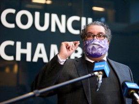 Mayor Naheed Nenshi speaks to reporters outside council chambers on Feb. 1, 2021.