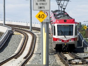 File photo: A CTrain moves westbound out of downtown Calgary, Alta., on Friday, July 24, 2015.