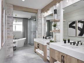 This master ensuite by Brookfield Residential includes a quiet area for soaking in an elegant tub, a separate shower and dual sinks.