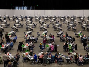 People receive shots at a mass COVID-19 vaccination site at Lumen Field Event Center in Seattle on March 13, 2021.