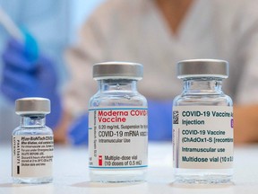 Used vaccine vials that contained (L-R) Pfizer-BioNTech, Moderna and AstraZeneca Covid-19 vaccines are pictured at the Skane University Hospital vaccination centre in Malmo, Sweden, on February 17, 2021.