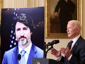President Joe Biden and  Prime Minister Justin Trudeau, appearing via video conference call, give closing remarks at the end of their virtual bilateral meeting from the White House in Washington in February 2021.