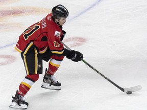 Stockton Heat Matthew Phillips moves with the puck against Toronto Marlies Justin Brazeau during a game at Scotiabank Saddledome on Sunday, February 21, 2021. Azin Ghaffari/Postmedia